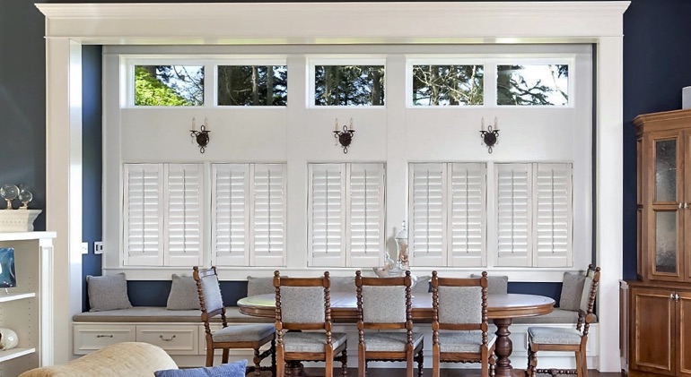 Tampa dining room with shut plantation shutters.